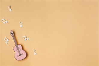 Pink guitar with white musical notes