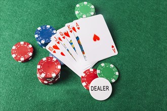 Playing cards casino chips green surface