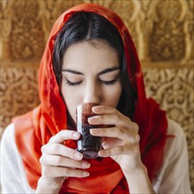 Portrait muslim woman drinking tea
