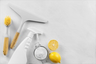 Top view cleaning products with baking soda lemon