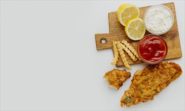 Top view fish chips with ketchup copy space