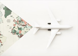 Travel concept with world map toy plane