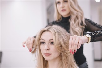 Woman setting hair girl parlor