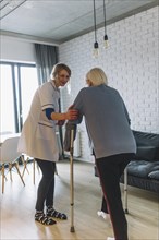 Woman walking with nurse retirement home