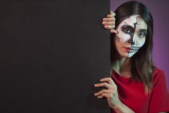 Woman wearing halloween costume wall