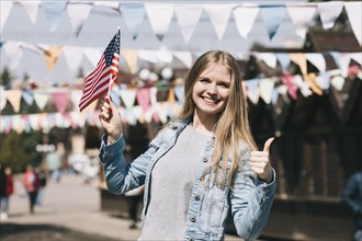 Young woman with usa flag festival