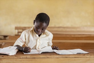 African kid learning class 3