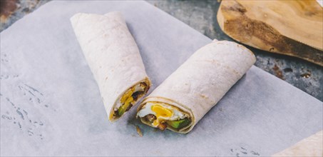 Close up wrap tacos with butter paper