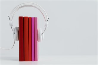Colorful books with headphones