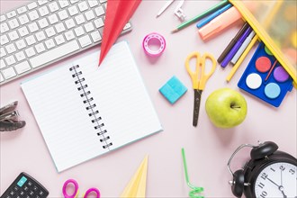 Creative workspace with notebook school supplies