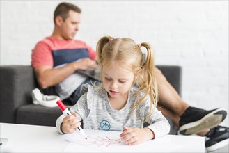 Cute girl drawing sketch with marker home