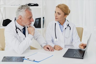 Doctors doing research laptop