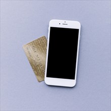 Elevated view mobile phone credit card grey background