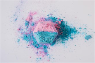 Elevated view pink blue colored bath bomb white background