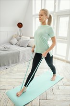 Female working out mat with elastic band