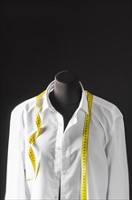 Front view dress form with shirt measuring tape