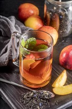 Glass with peach ice tea flavor