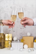 Hands toasting champagne glasses