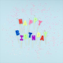 Happy birthday candles glitter blue background