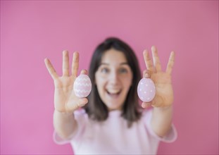 Happy woman holding easter eggs