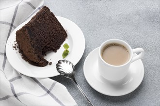 High angle chocolate cake slice with coffee