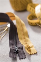 High angle zippers with measuring tape thread