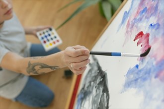 High view person creating painting