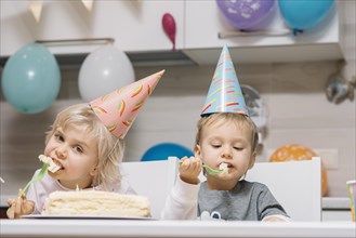 Kids eating cake birthday party