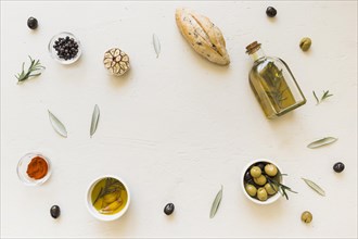 Layout oil bottle bread olives spices