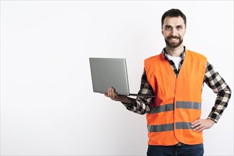 Man posing with laptop safety vest