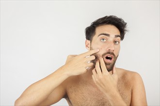 Man surprised with new pimple
