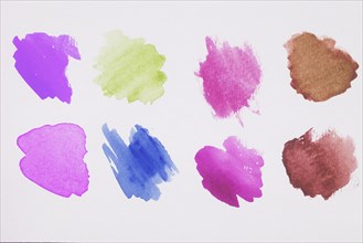 Mix brown green blue violet pink paints white paper