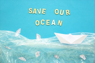 Save our ocean words paper boat