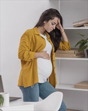 Side view pregnant woman home feeling very well