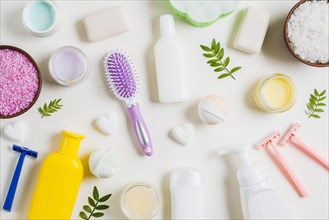 Spa cosmetics products with razor hairbrush white background