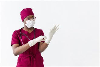 Specialist female doctor putting gloves