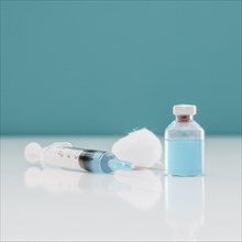 Syringe with cotton vaccine bottle table