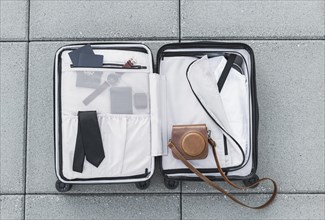 Tourist suitcase sitting ground