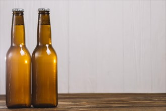 Two beer bottles wooden surface