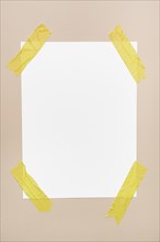 White sheet stick wall with yellow tape