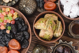 Arabian sweets ramadan baklava lukum dried fruits bowl desk