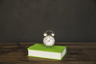 Book table with alarm clocks