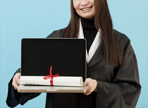 Close up girl holding laptop