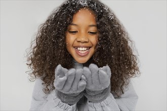 Close up smiley girl wearing gloves