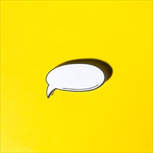Comic empty speech bubble retro pop art style with shadow yellow background