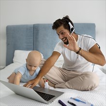 Dad working from home during quarantine with child