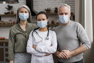 Doctor posing with her patients