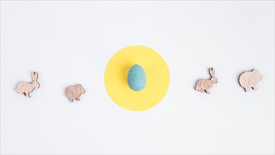 Easter egg yellow circle figures sheep rabbits