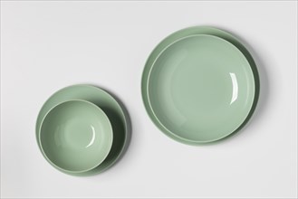 Flat lay green plates arrangement
