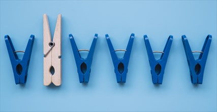 Flat lay plastic clothespins wooden one